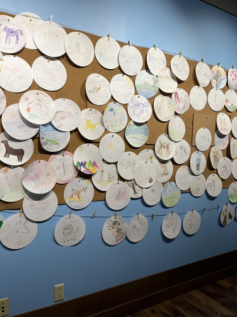 Kids sketches inside the National Museum of Wildlife Art in Jackson Hole WY