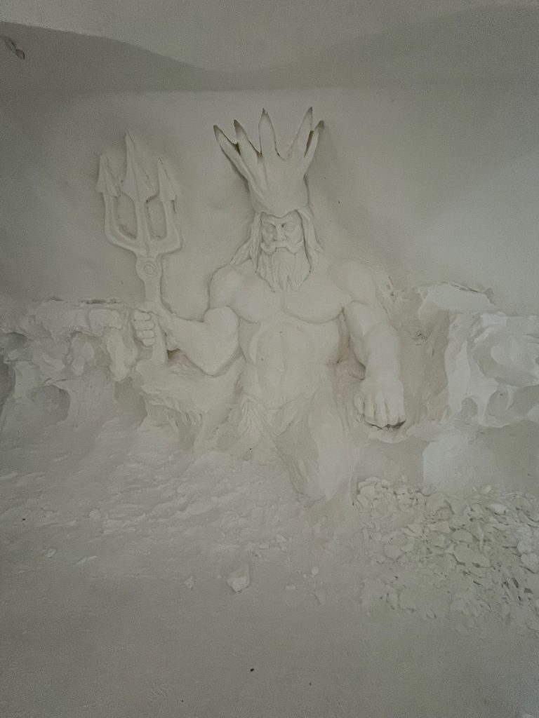 Ice carving of Greek god Poseidon inside the igloo hotel at Sorrisniva