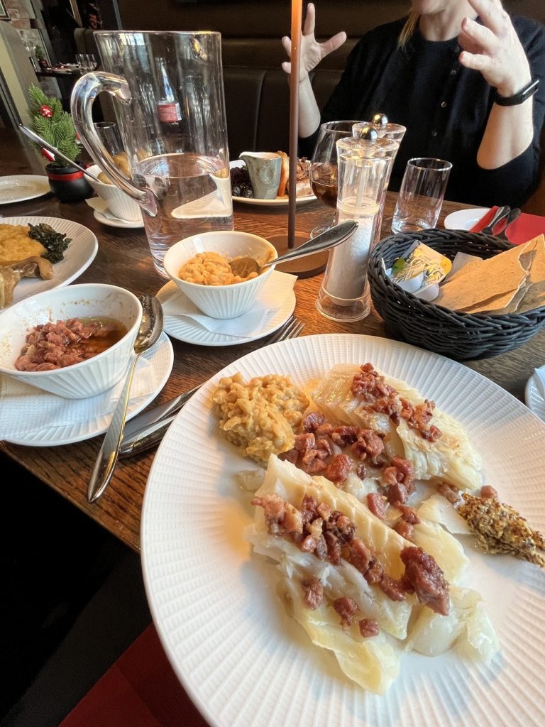 Traditional lutefisk served at the historic Bryggestuen-Bryggeloftet restaurant in Bergen Norway