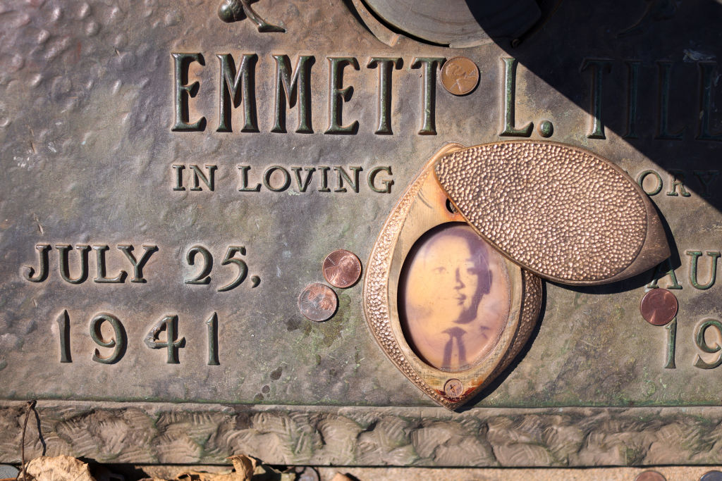 ALSIP, ILLINOIS - MARCH 22: A faded photograph is attached to the  headstone that marks the gravesite of Emmett Till in Burr Oak Cemetery on March 22, 2021 in Chicago, Illinois. Till's brutal murder in Money, Mississippi in the summer of 1955 and his mother's decision to hold an open-casket funeral to expose the brutality of the murder is credited with igniting the modern civil rights movement. The home in Chicago where Till lived with his mother recently gained Chicago landmark status and there are plans to turn the home into a museum and the church where his funeral was held is being considered for designation as a National Monument.    (Photo by Scott Olson/Getty Images)