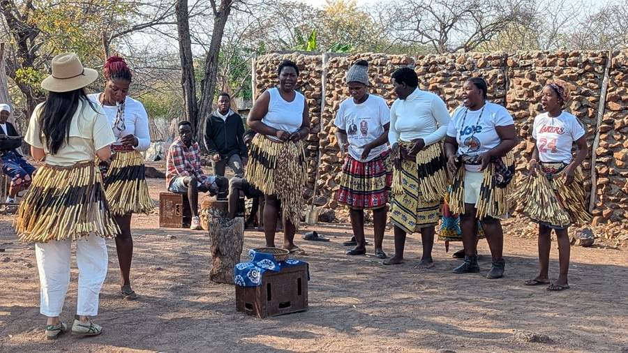 Locals interacting with CroisiEurope Safari cruise guests