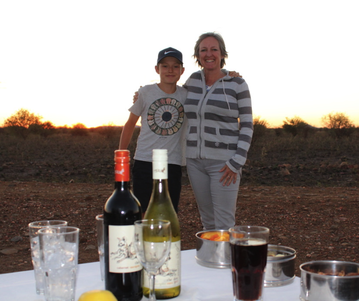 Jack Frater and his mom Jo Prater enjoying a "sundowner" on safari in Madikwe Game Reserve