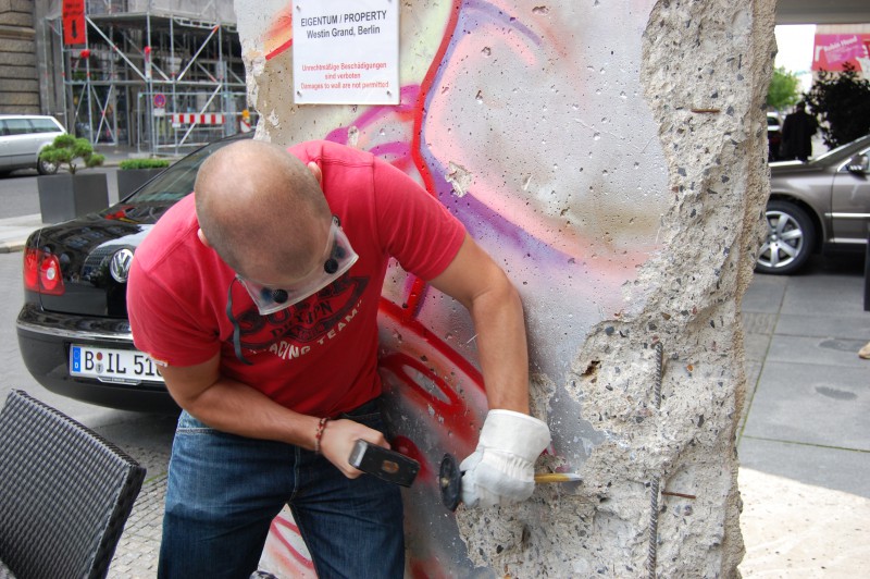 Guest of the Westin Grand Berlin picking at the Berlin Wall