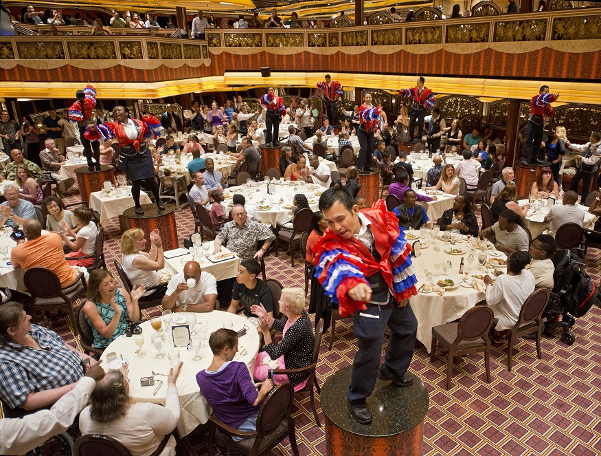 Waiters dance for guests as part of post-dinner entertainment aboard the Carnival Freedom, which operates year-round four- to seven-day cruises from Galveston