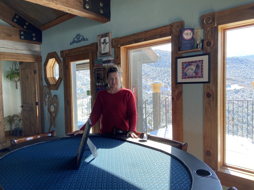 Kelly Shumway with the poker table she built for the Cedar Bend cabin at Whispering Oaks Ranch near Moab UT