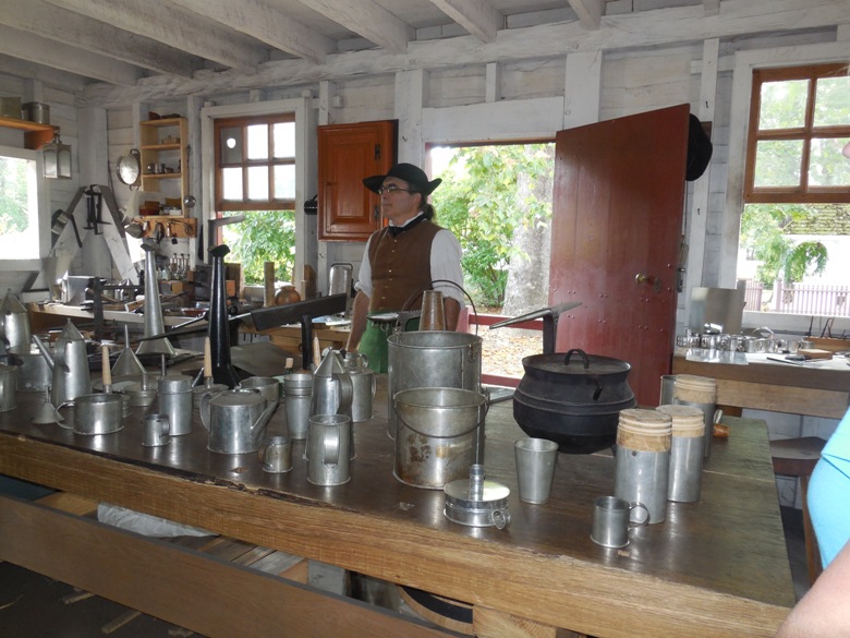 A tinsmith explains his craft in Colonial Williamsburg