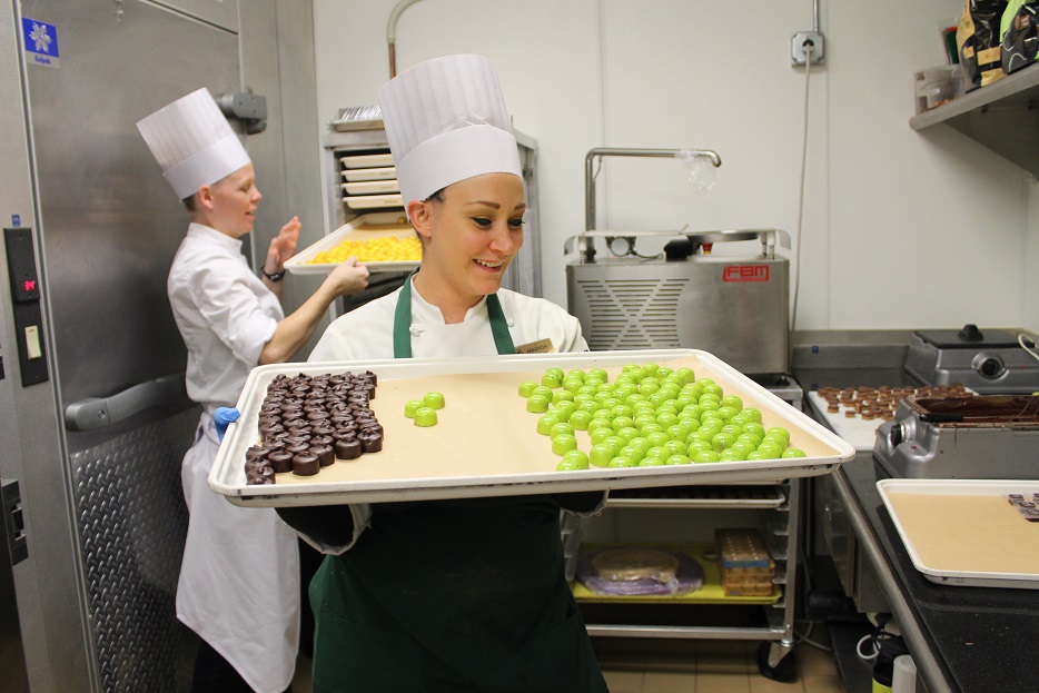 Chocolatier Amanda Houdek displays freshly made truffles