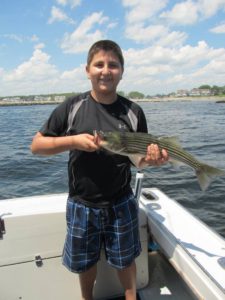 Enesi with his first fish caught ever off Kennebunkport ME
