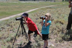 Ethan and Hannah viewing Yellowstone bear from a safe distance