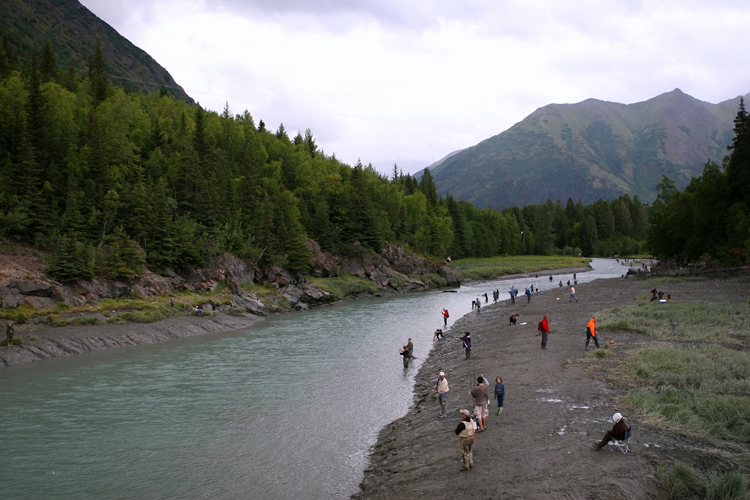 Fishing along the riverbank in Alaska