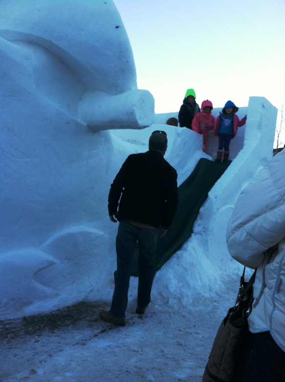 Fun on a snow slide at the sculpture competition