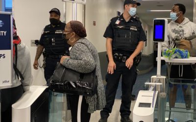 Armed police greet passengers after the THIRD JetBlue aircraft fails to depart