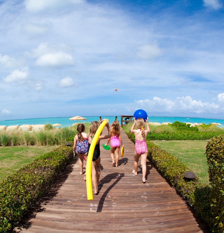 Kids off to the beach at The Somerset Turks and Caicos