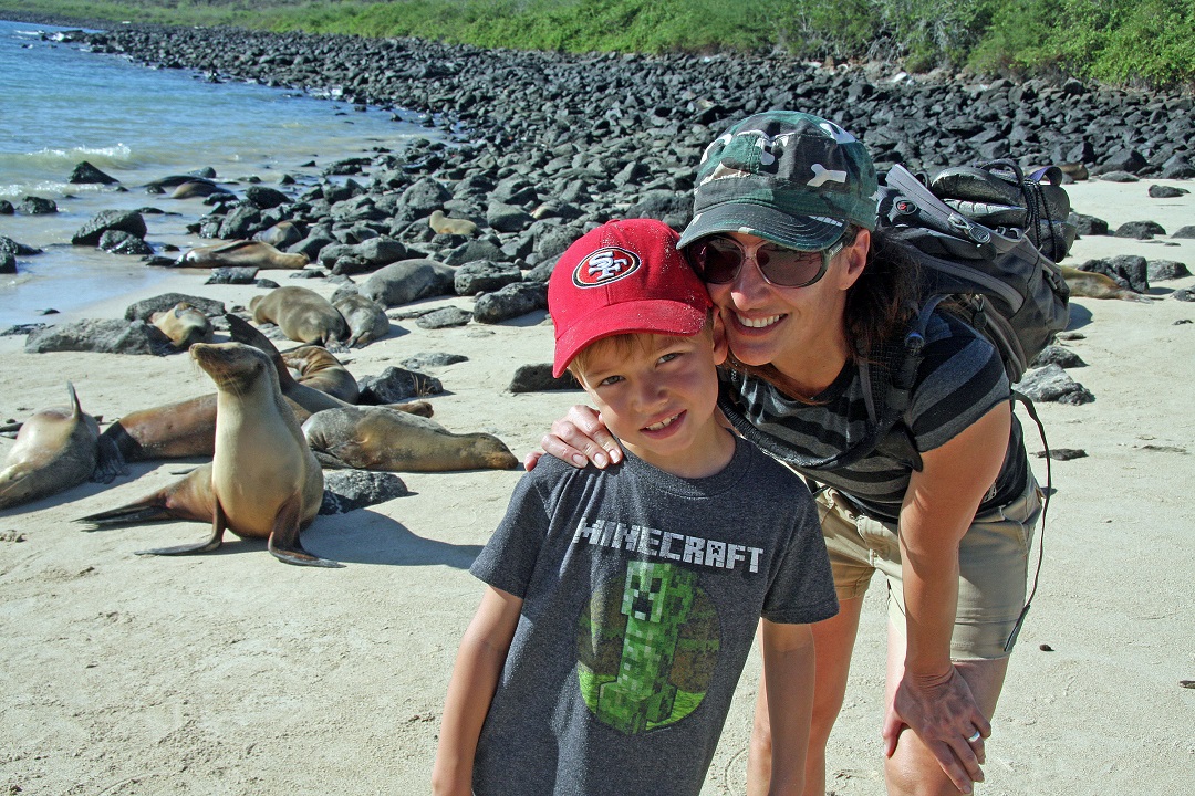 Mom and son visit sea lions in the Galapagos with AdventureSmith Explorations