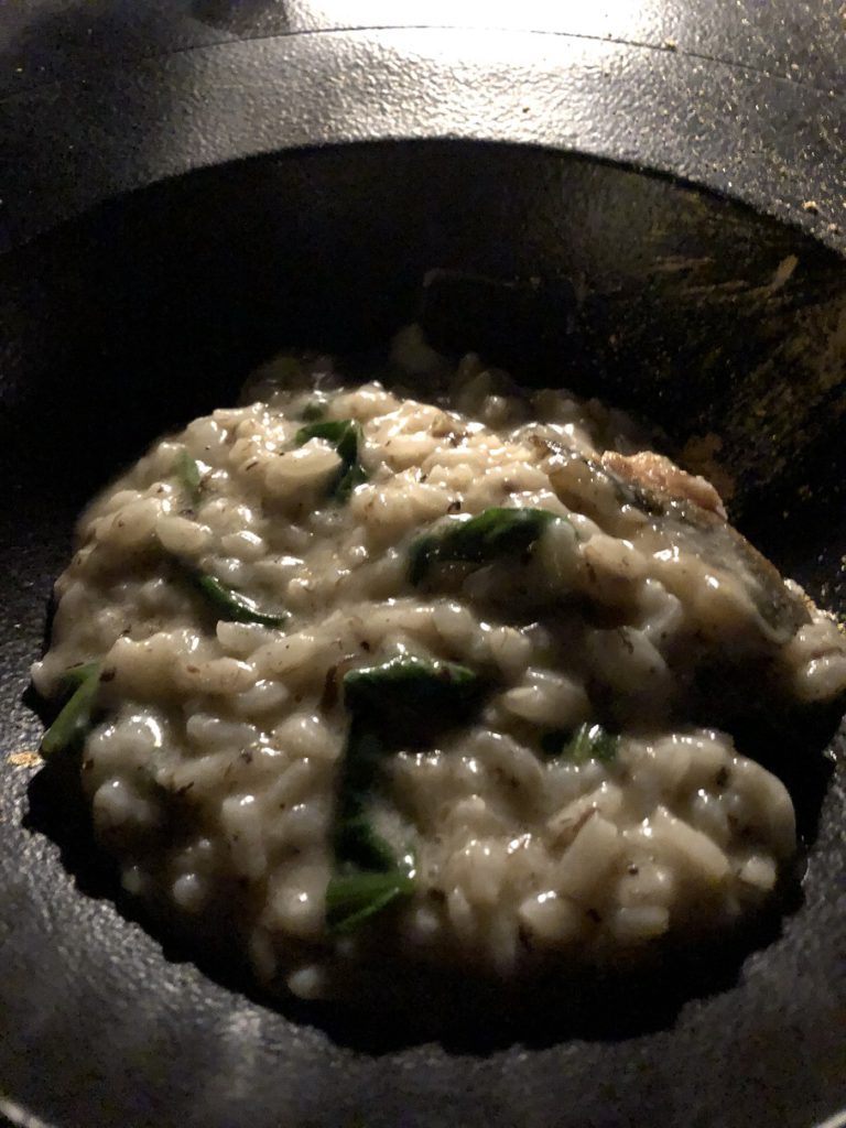 Delicious rissoto with branzino, spinach, truffle and gold powder