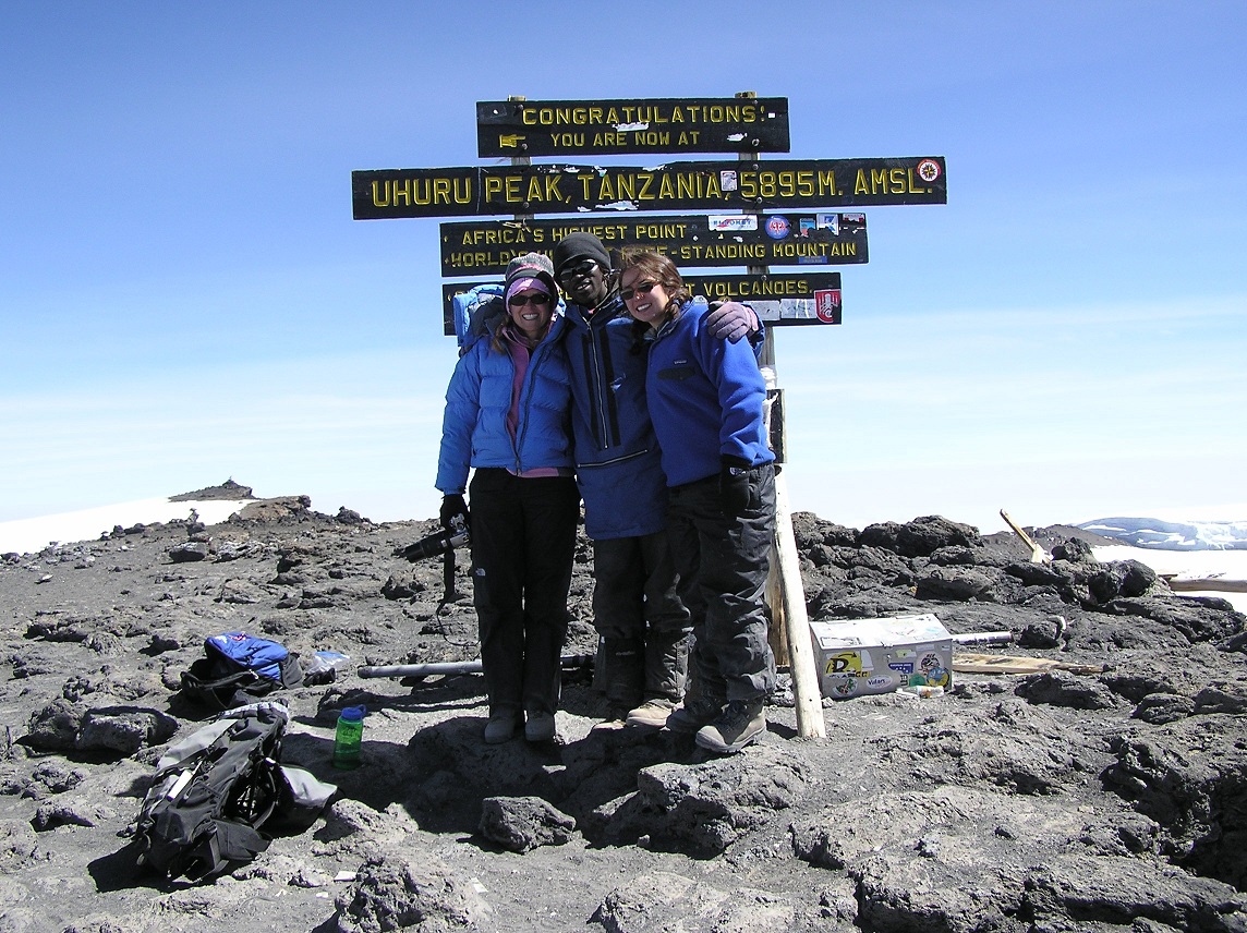 Reggie (left) at the summit of Mt. Kilimanjaro