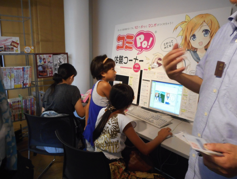 Kids designing manga on computers