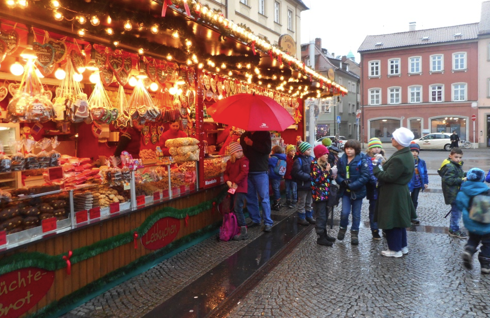 Local school kids head straight to the candy seller at the Bamberg Christmas market