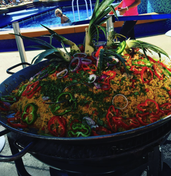 Arroz con pollo ready to be served on the pool deck of the Norwegian Gem