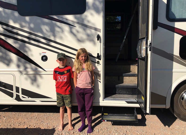 Carl and Asta Dam next to their RV at the KOA Moab campground