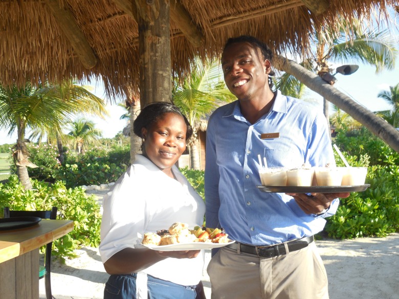 Staff serving snacks and drinks at Jumby Bay