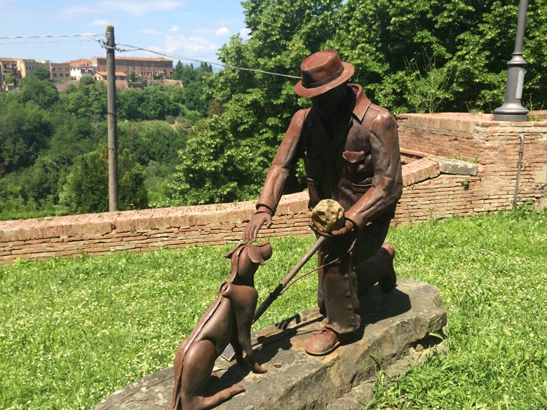 Statue of Truffle Hunter and Dog in Tuscany