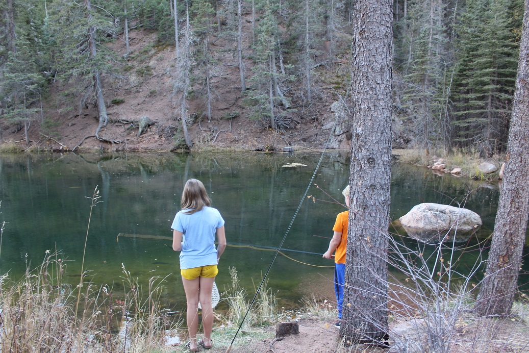 The Trainer kids fishing in one of The Ranch at Emerald Valley ponds