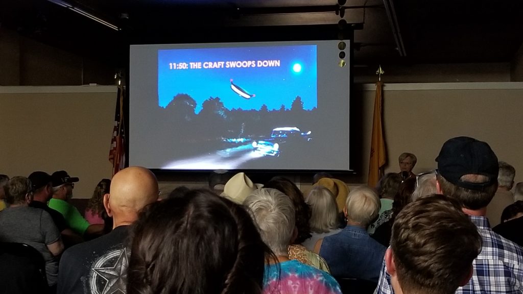 The audience at the Internationl UFO Museum is captivated by a presentation on the Betty and Barney Hill Abduction from 1961.