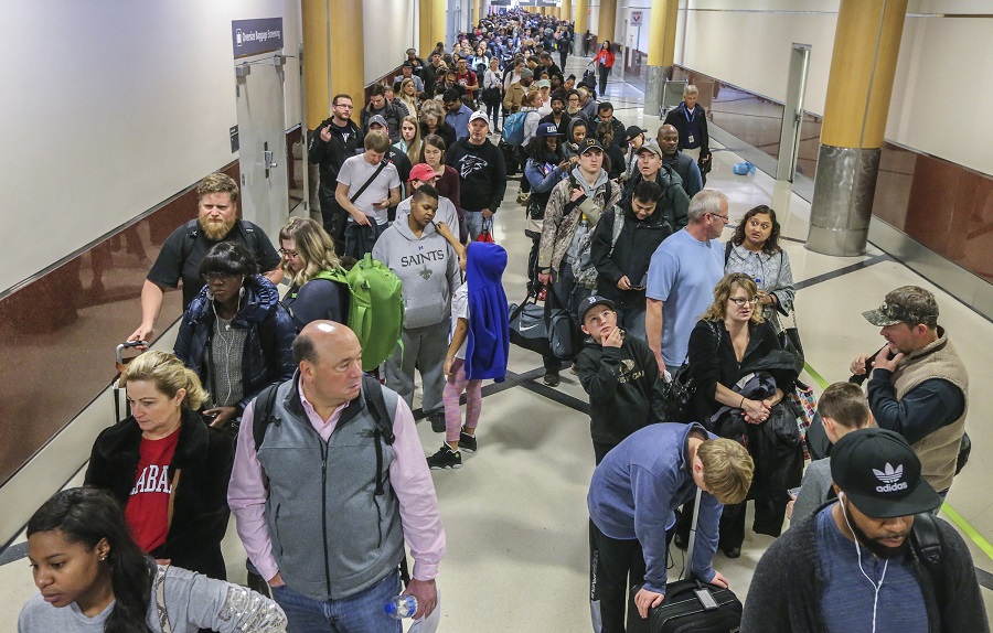 The lines were long in the North Terminal waiting for the security checkpoint on Monday Dec. 18, 2017 at Hartsfield-Jackson International Airport, the day after a massive power outage brought operations to halt