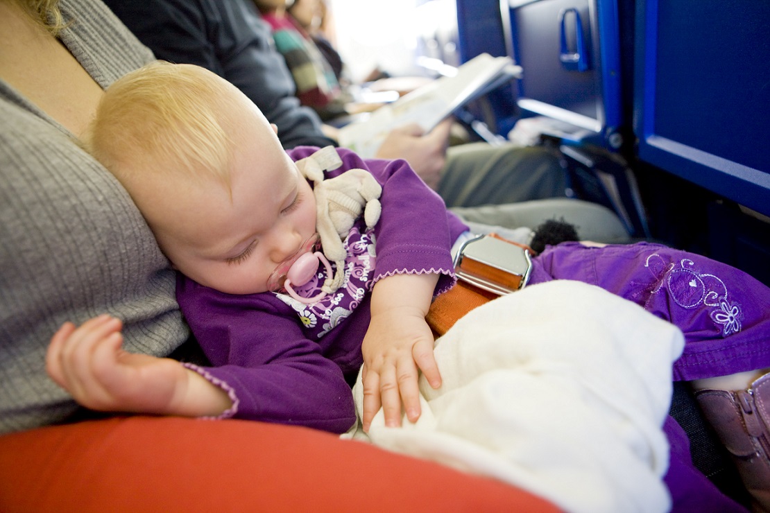Toddler sleeping on plane