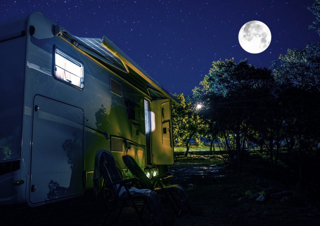 Recreational Vehicle Class C Motorhome Under Starry Sky.