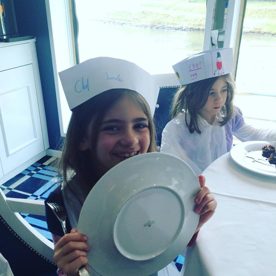 Kids finishing off waffles they made on Uniworld River Queen