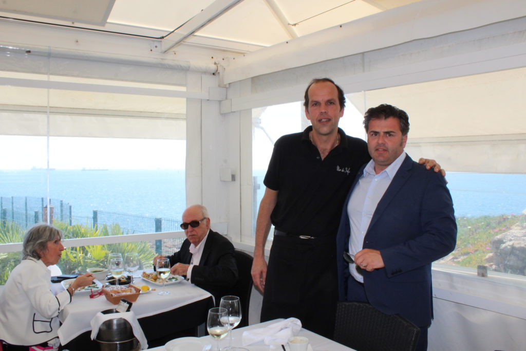 Tour guide Eduardo Nobre (right) with owner of Mar do Inferno restaurant