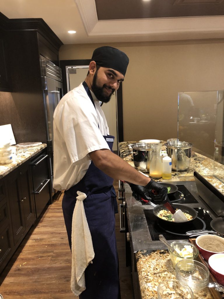 Chef making omlettes on in Gold Lounge at Fairmont Austin