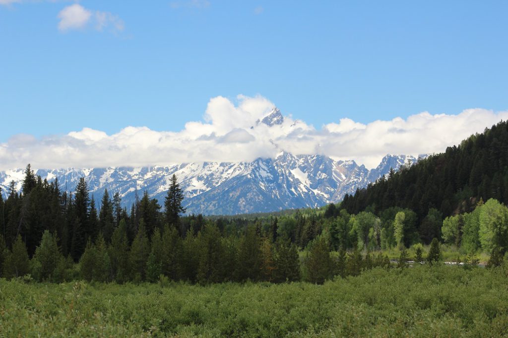 Clouds lift enough for a glimpse of Grand Teton mountain