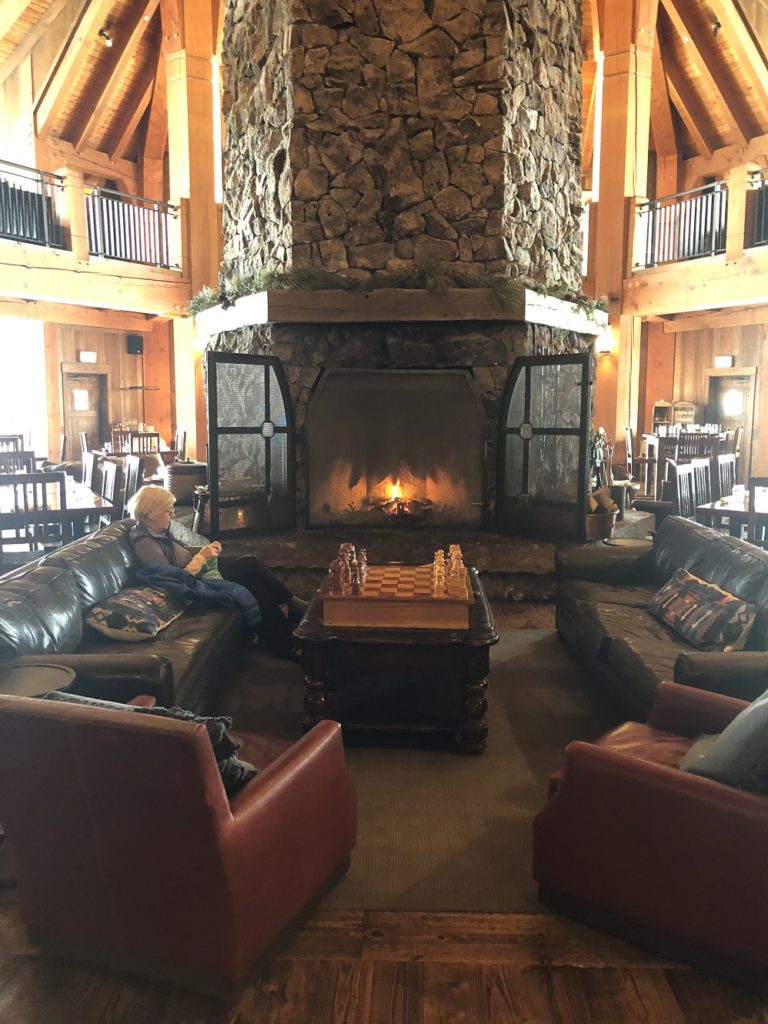 Cozy fireplace in Heck's Tavern at Devil's Thumb Ranch