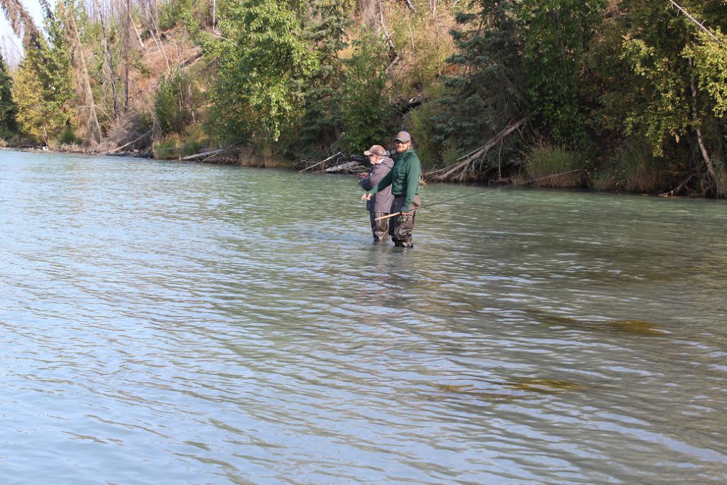 Guide Sean Smart helps Eileen with fly fishing on the Kenai River