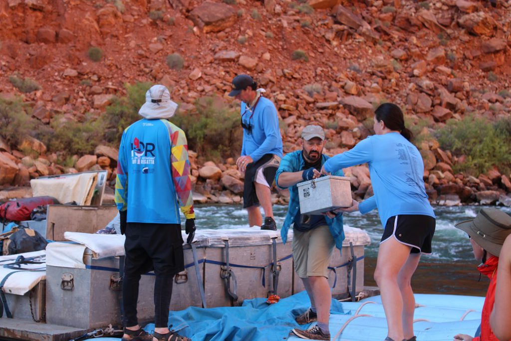 Everyone pitches in to set up our first campsite