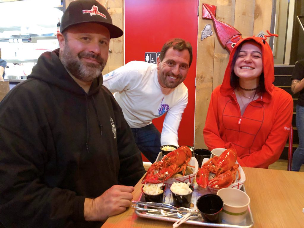Maine Shack co-owners Drew Ryan and John Caprio serve up freshly cooked lobsters