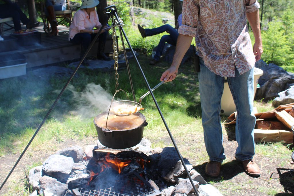 Veggie paella and seafood boil cooking on horseride lunch at Flathead Lake Ranch