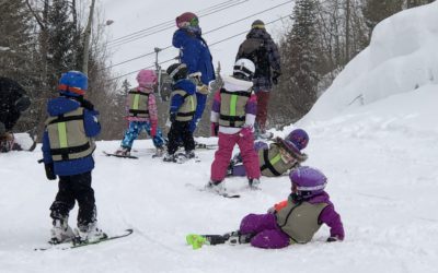 Kids playing on a ski slope near Vail Village