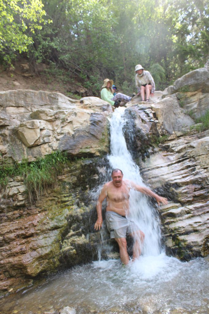 Layne Lisinbee from San Diego enjoys a frigid showed in Ely Creek Falls