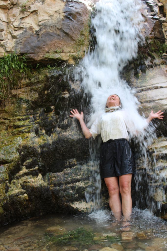 Pam Jones enjoying a very cold dip under Ely Creek Falls