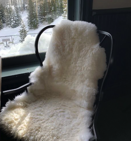 Sheepskin backs on chairs at Mid-Mountain Restaurant PCMR