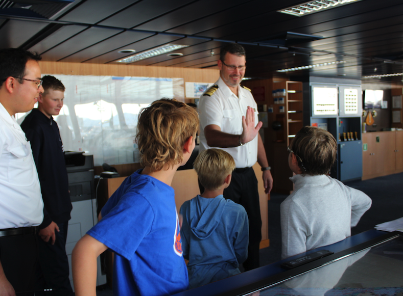 Kids meet the Captain of the Mariner on the Bridge