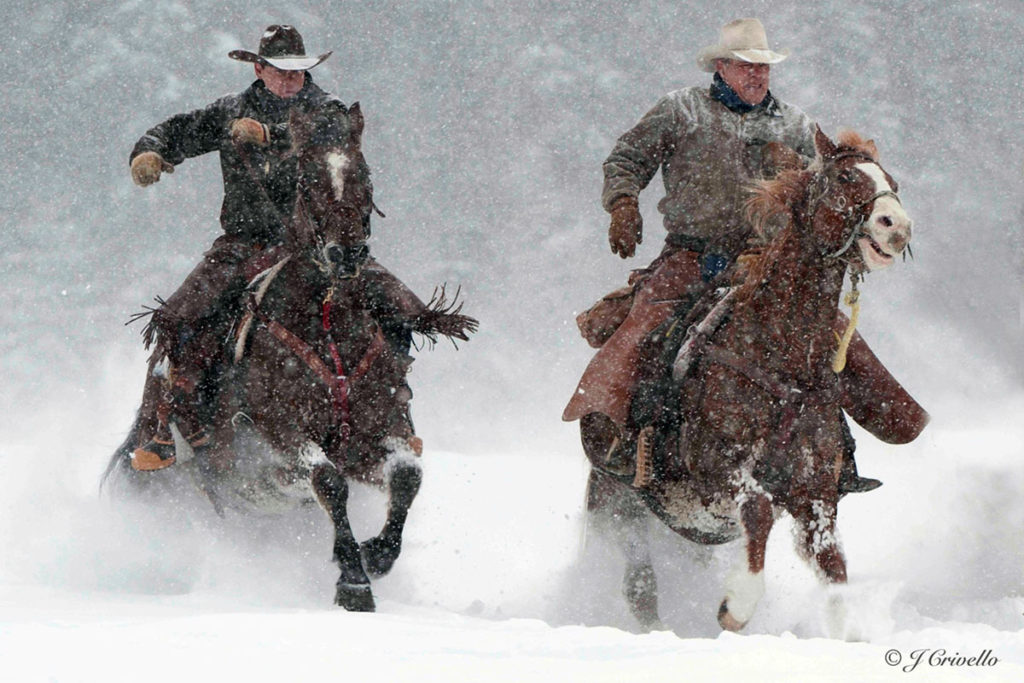 Wranglers at the Bar W Guest Ranch In Montana working in the snow