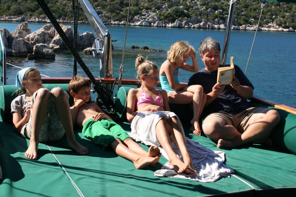Reading on a gulet boat on the Aegean Sea.