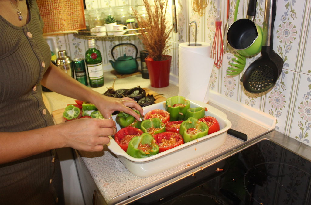 Preparing the stuffed tomatoes and peppers