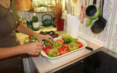 Preparing the stuffed tomatoes and peppers