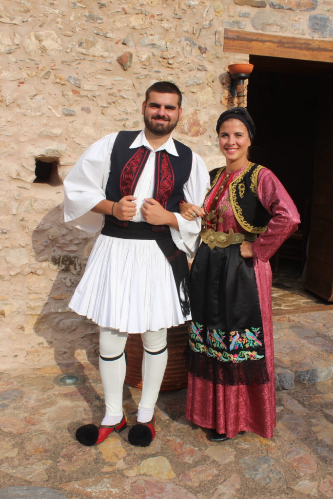 Locals dressed in traditional Greek costumes at Liotrivi Mansion